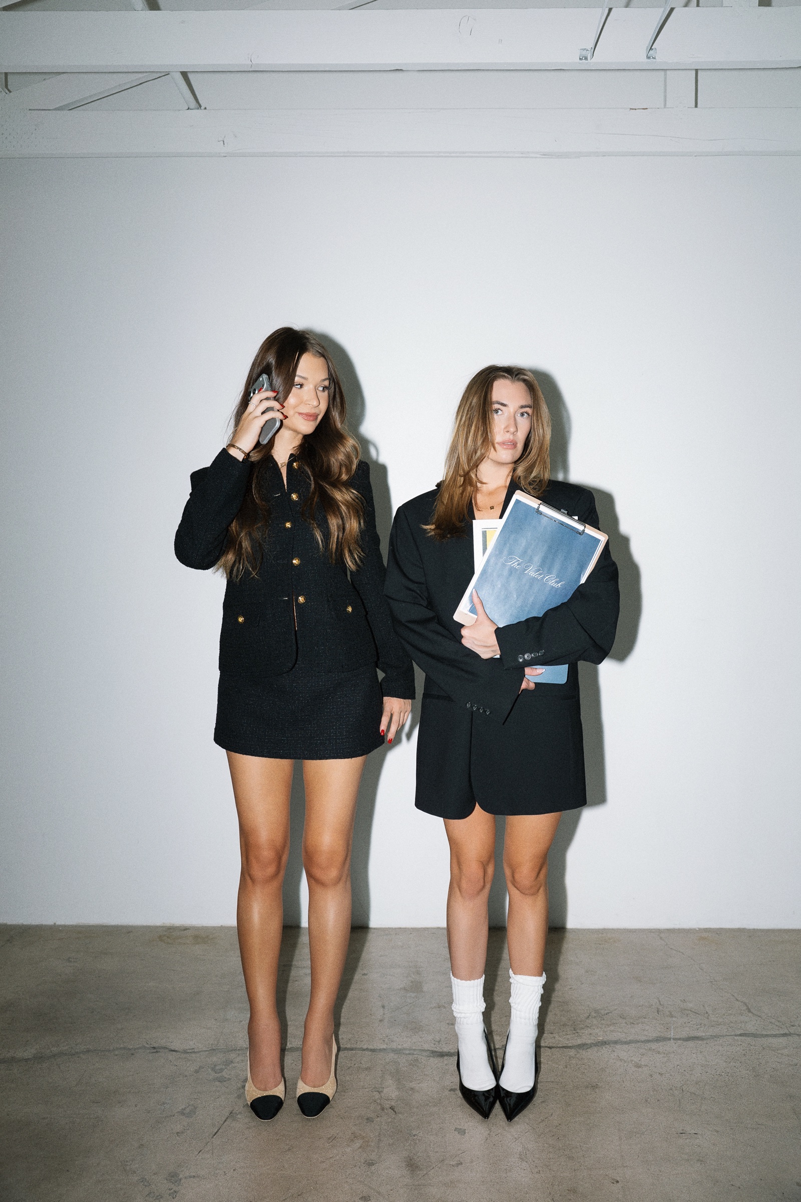 The Valet Club founders standing together with styling materials